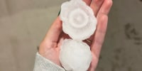 Volatile weather was honing in on parts of Kansas and Missouri Wednesday night, with some storms bringing massive chunks of hail.