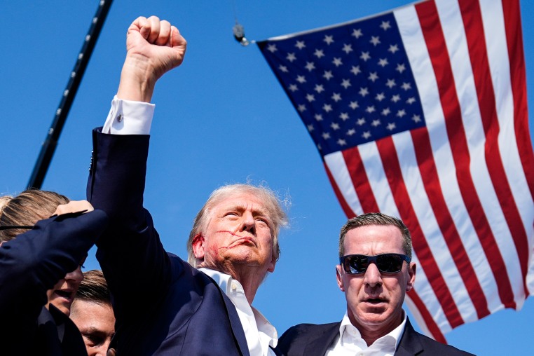 Former President Donald Trump surrounded by U.S. Secret Service 