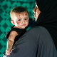 Palestinian toddler Rim Abu Hayya is carried by her aunt Ayat in a tent shelter west of Khan Yunis in the southern Gaza Strip on August 13, 2024.