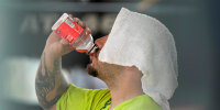 A construction worker hydrates.