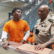 Lieutenant Michael Lewis jokes around with members of a new mental health community inside the New Orleans jail.