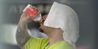 A construction worker hydrates at the Shedd Aquarium in Chicago on Aug. 27, 2024.