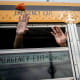 Nicaraguan citizens wave from a bus.